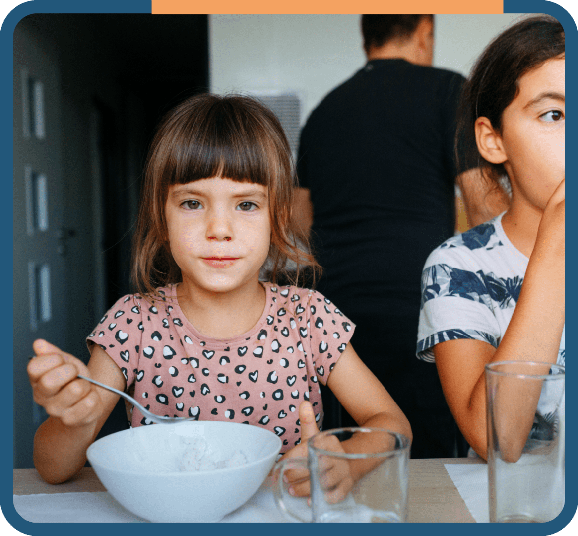 11 Children eating at a table together.